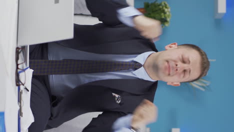 Vertical-video-of-Home-office-worker-man-is-fun-and-cheerful.